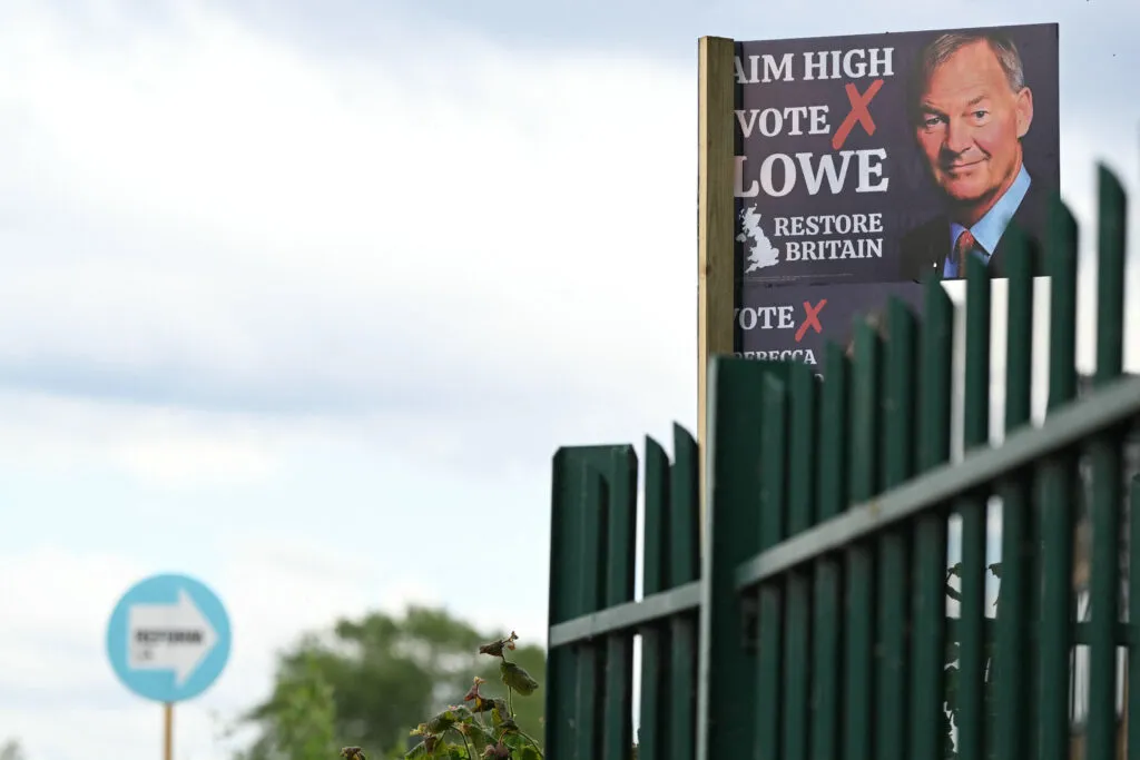 A poster for the new Restore Britain party beside a Reform UK poster, highlighting competition on the right